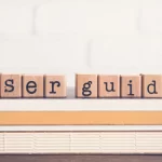 User Guide spelled out in wooden blocks