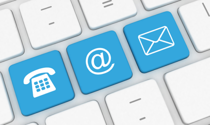 White keyboard with blue buttons with at symbol, phone icon, and mail icon.